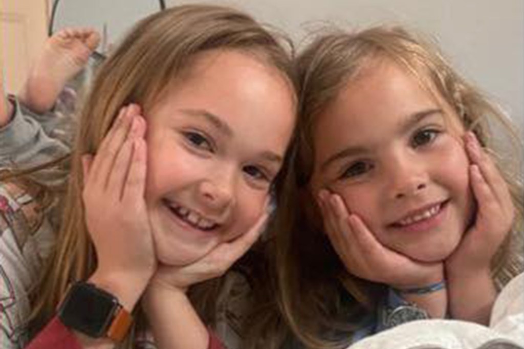 Evelyn and Olivia Decker, two sisters, smiling for a photo.