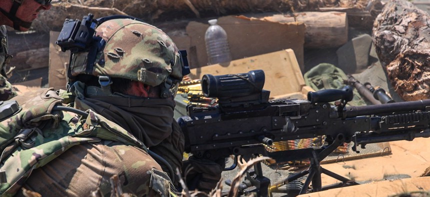 A U.S. Army soldier of 2nd Mobile Brigade Combat Team, 25th Infantry Division, shoots a M249 machine gun during Exercise Balikatan 25 in the Philippines on May 3, 2025.