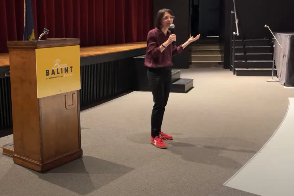 Becca Balint speaking at a podium.