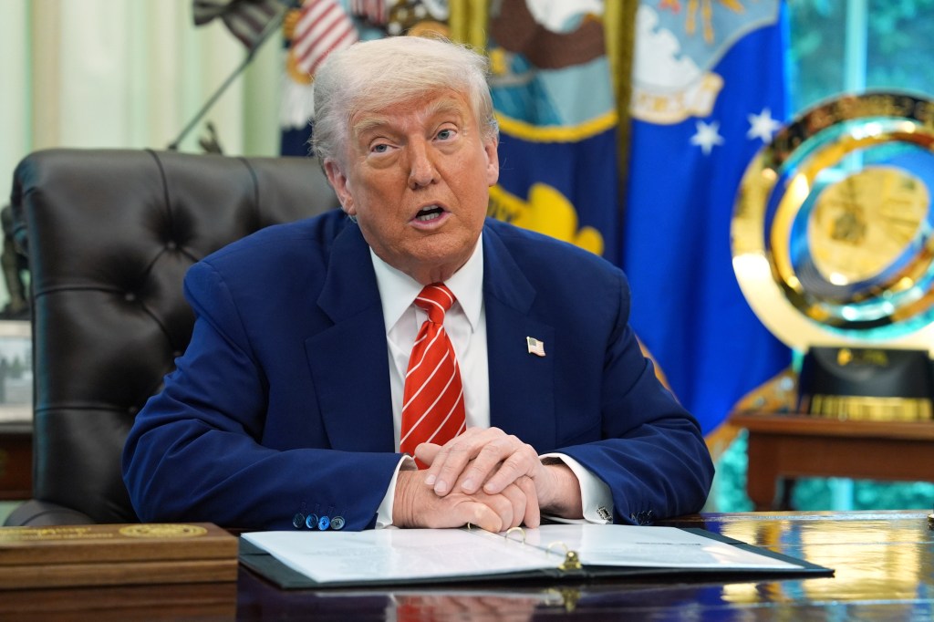 Donald Trump speaking at a news conference.