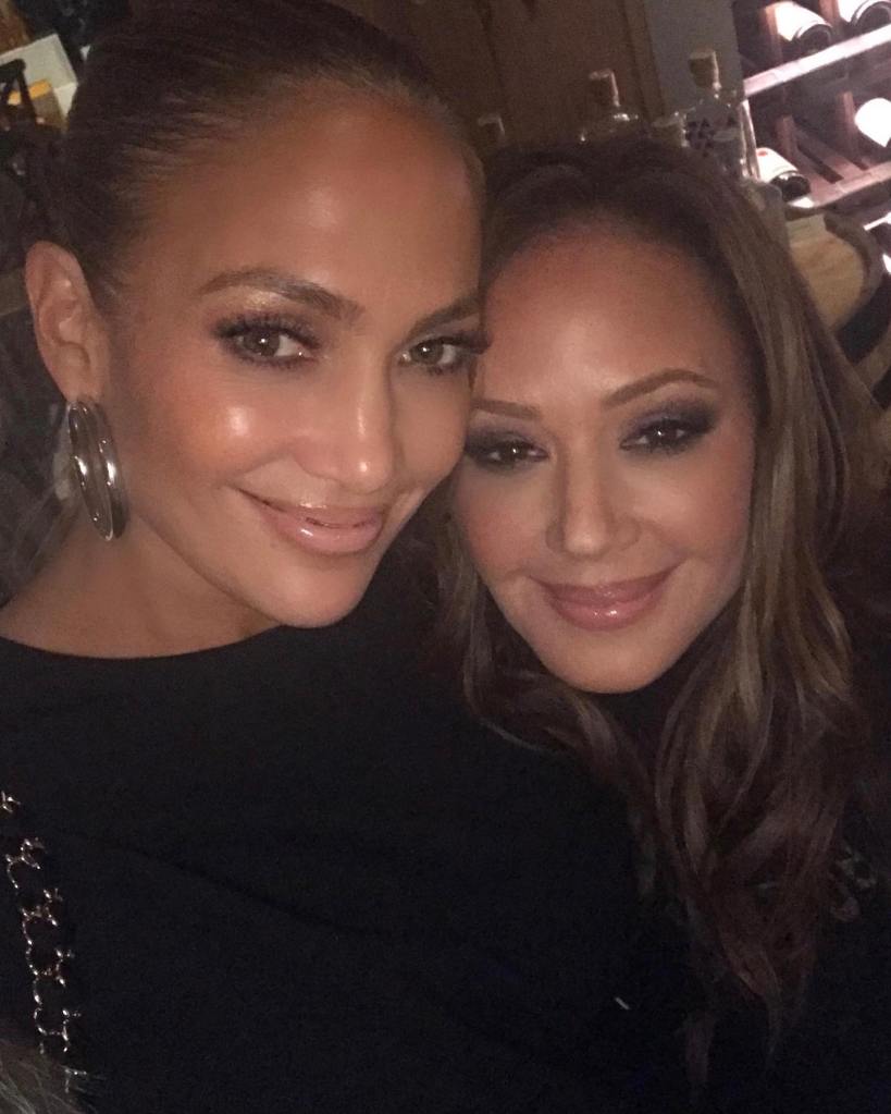 Leah Remini and Jennifer Lopez pose together.