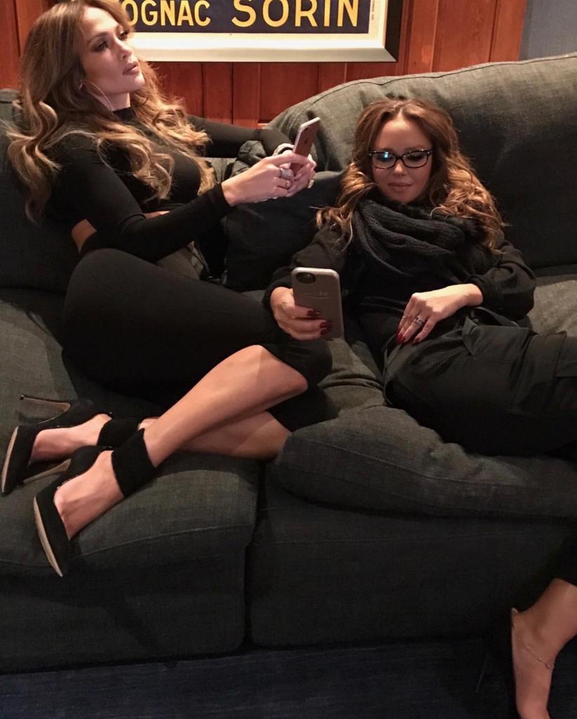 Leah Remini and Jennifer Lopez pose together.