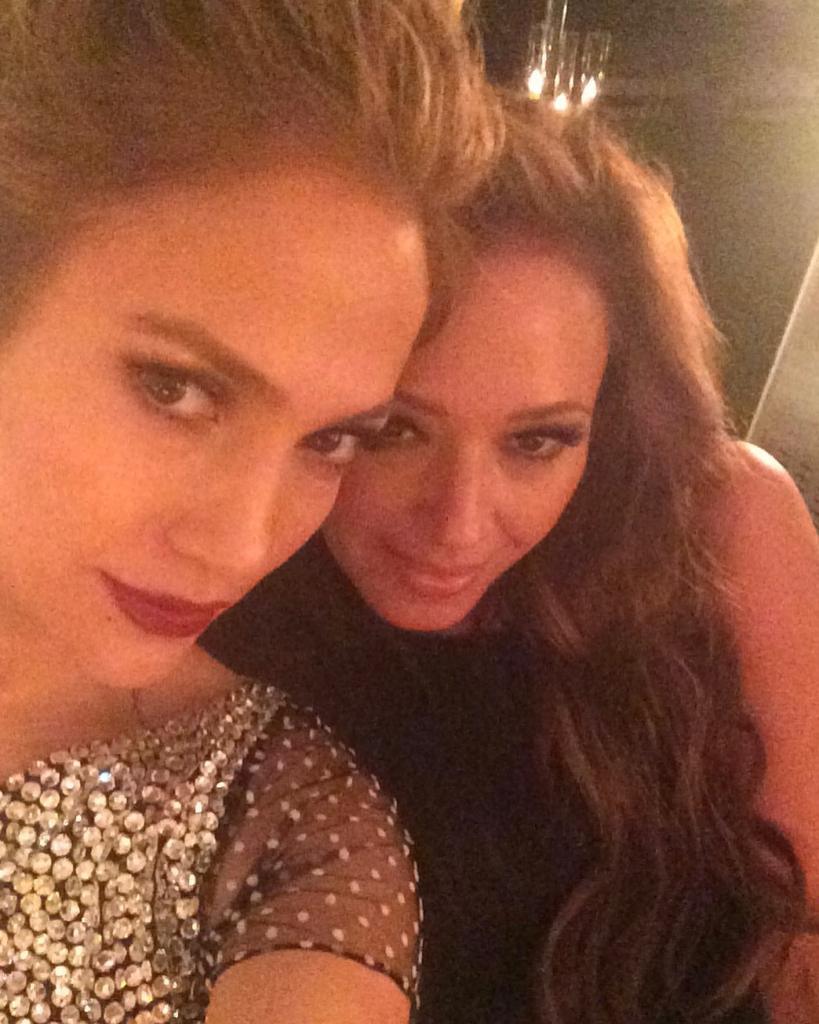 Leah Remini and Jennifer Lopez pose together.