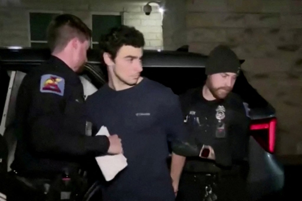 Suspect Luigi Mangione in police custody.
