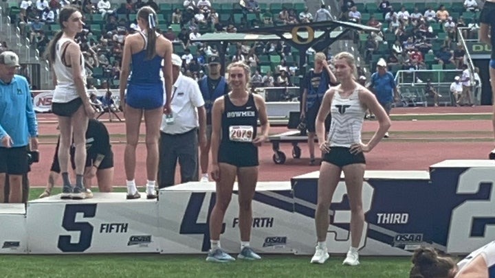 Reese Eckard and Alexa Anderson protest the girls' high jump medal ceremony at the Oregon State high school championships at Hayward Field on May 31, 2025.