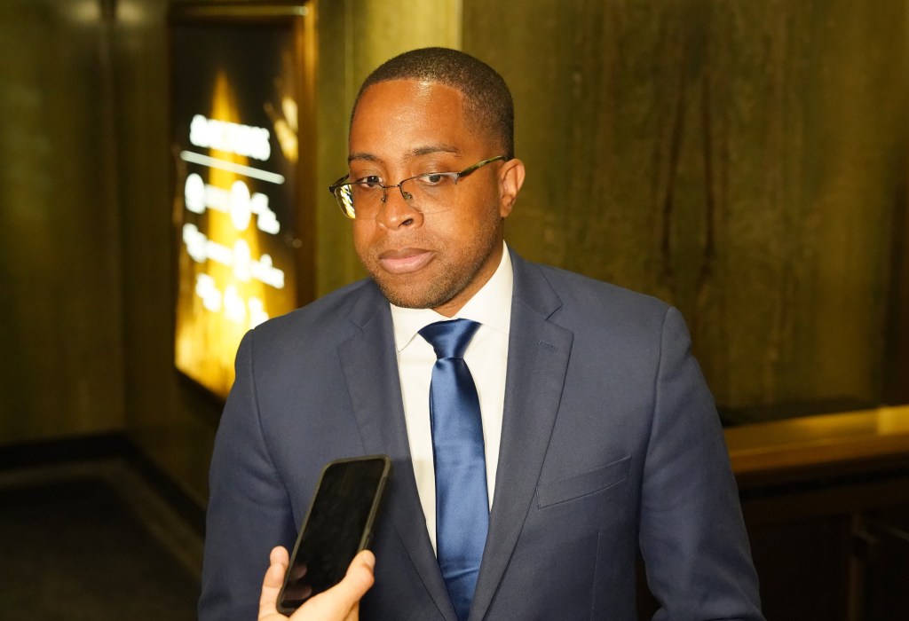 Zellnor Myrie talks to reporters after leaving the debate stage. 