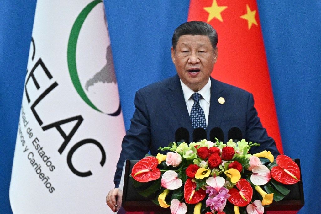 Xi Jinping speaking at a podium at the China-CELAC forum.