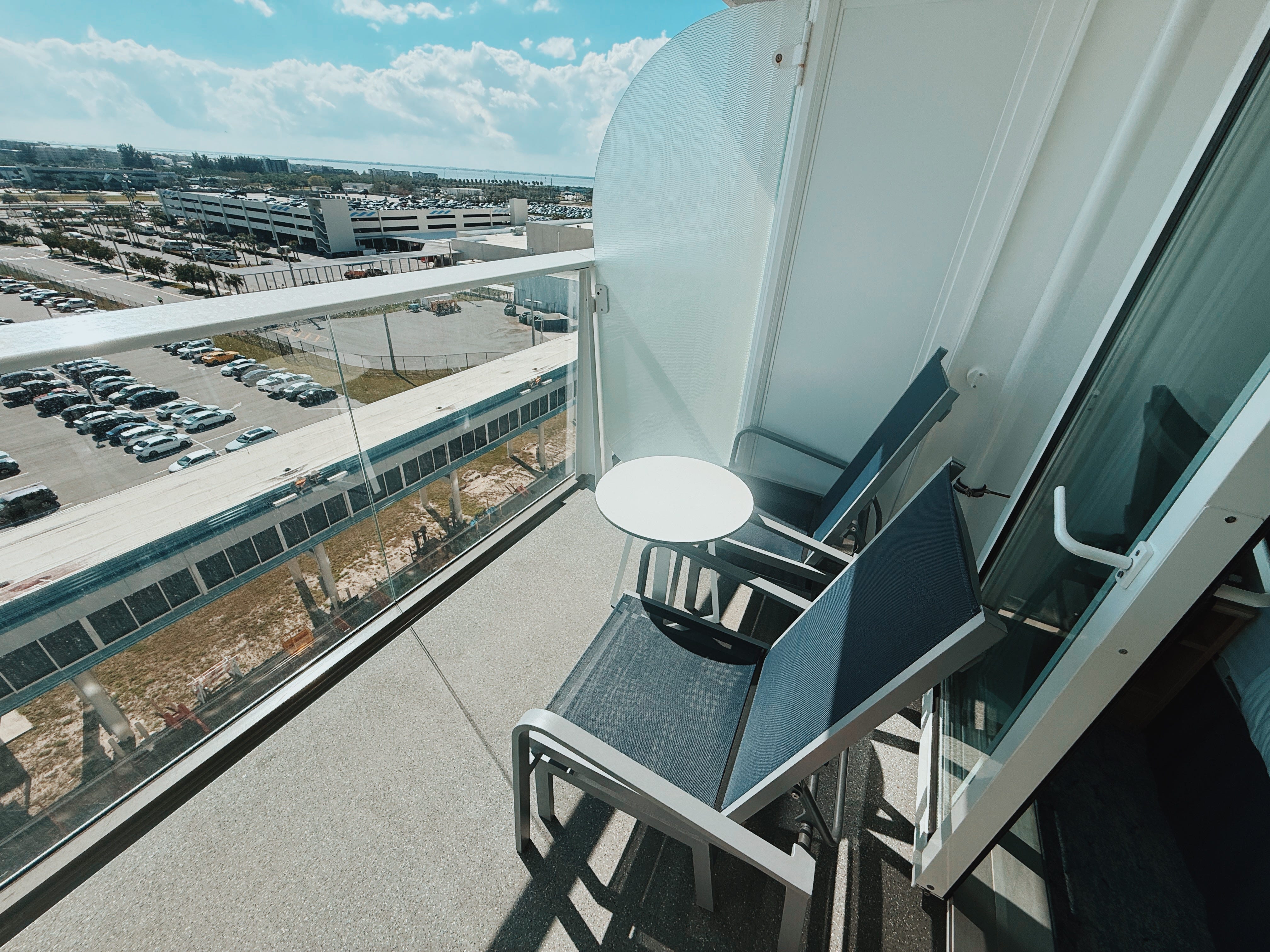 Balcony area with two chairs, table on Royal Caribbean Utopia of the Seas