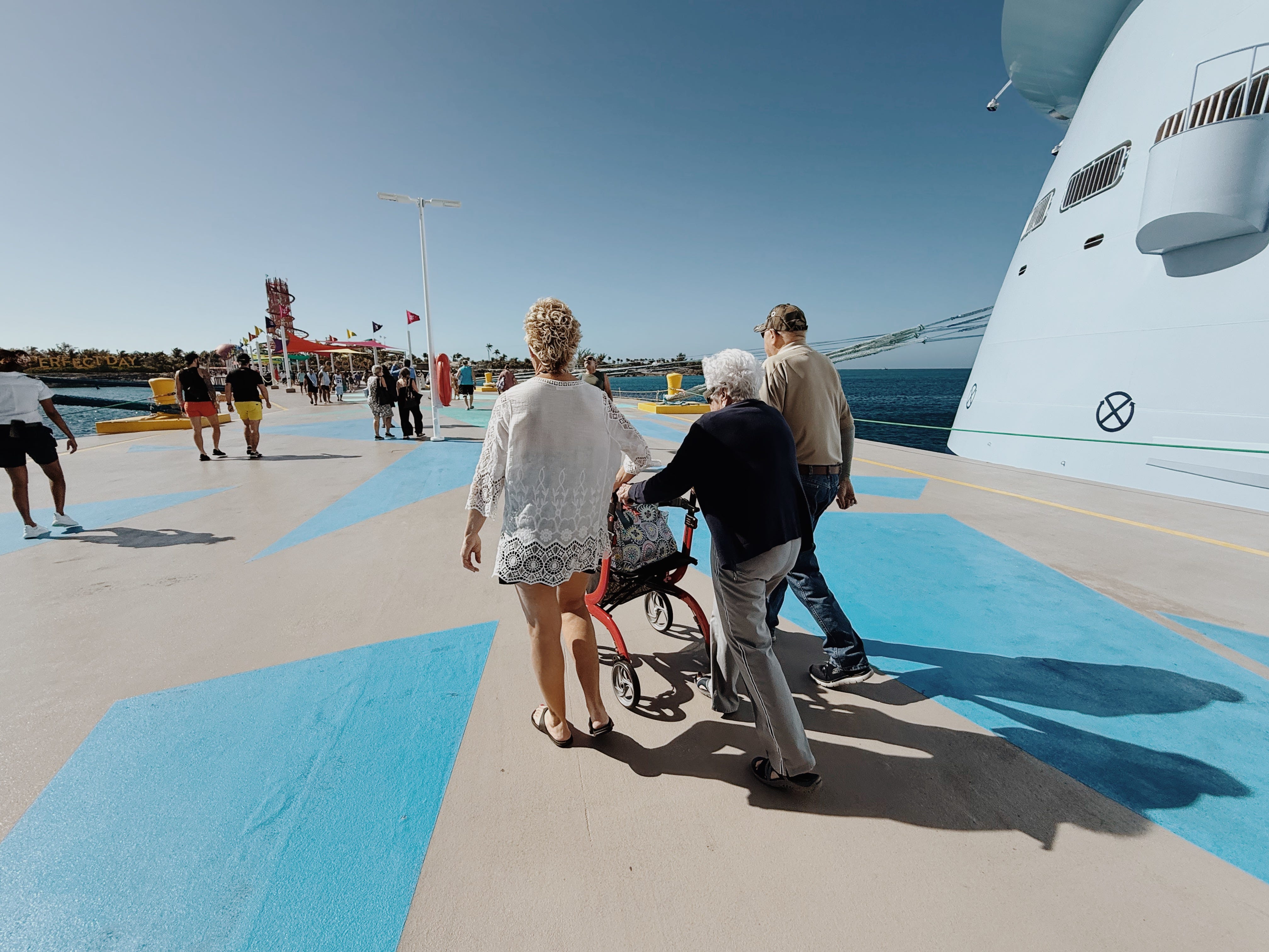 Author Allie Hubers, grandma, and family walking near cruise ship