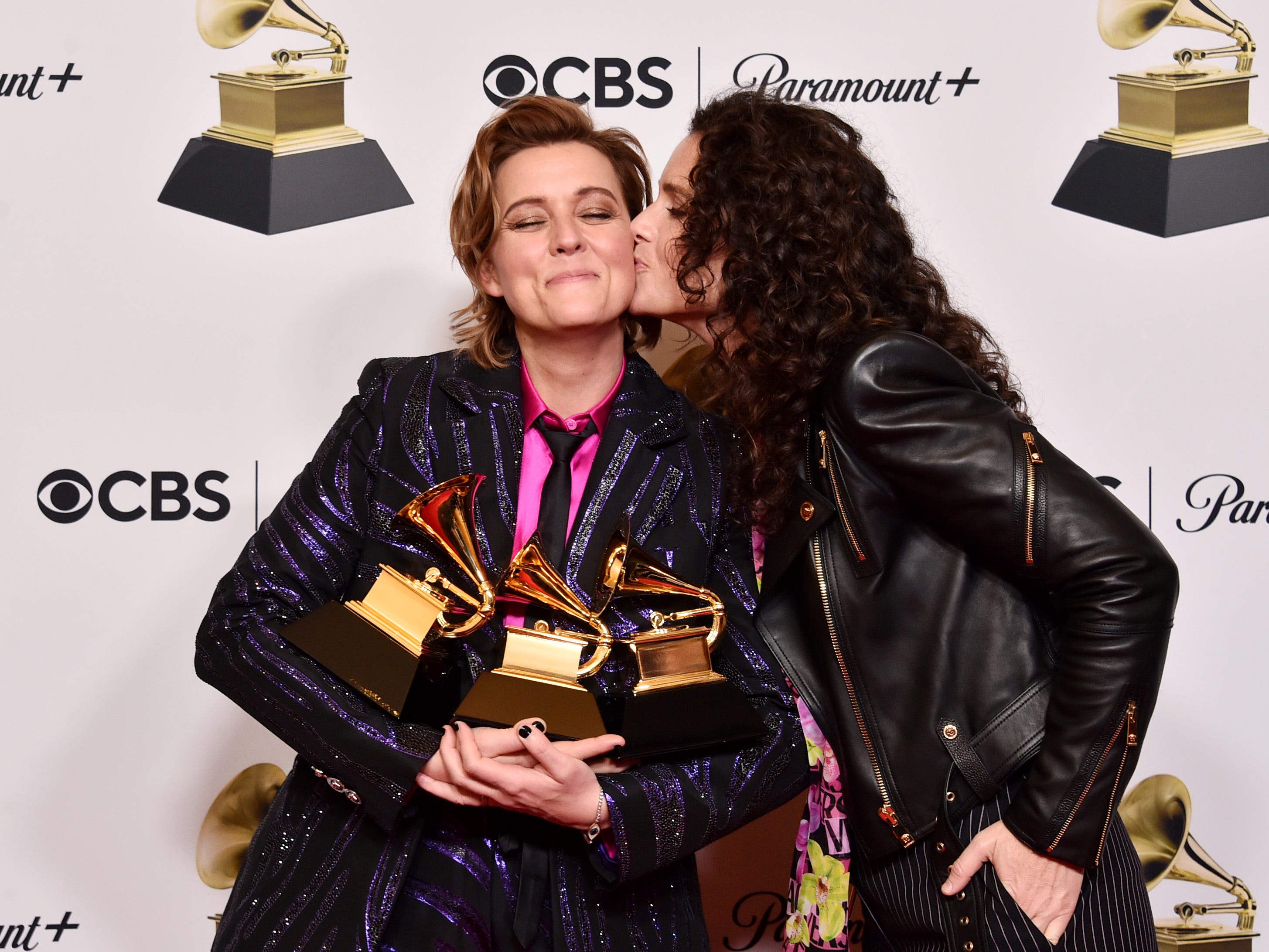 Brandi Carlile and Catherine Shepherd pose with the Best Americana Album Award for “In These Silent Days,” Best Rock Song Award for ”Broken Horses,” and Best Rock Performance Award for “Broken Horses” in the press room during the 65th GRAMMY Awards .