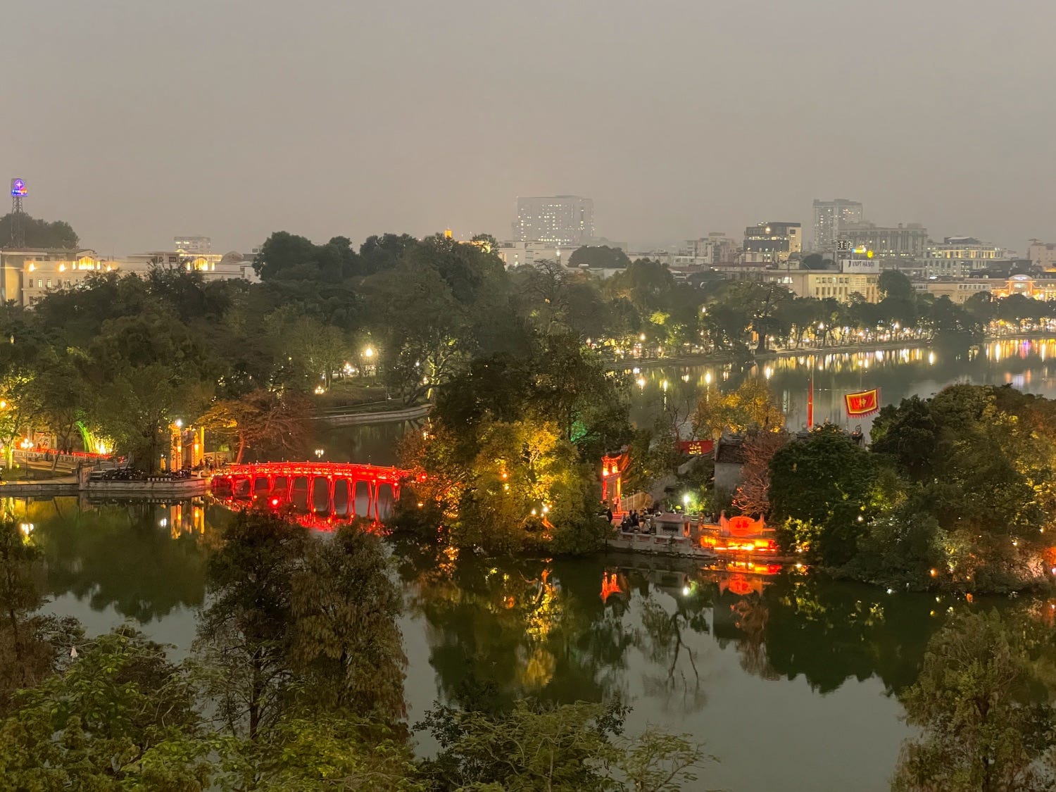 Photo from above of a red bridge in Hanoi, Vietnam.