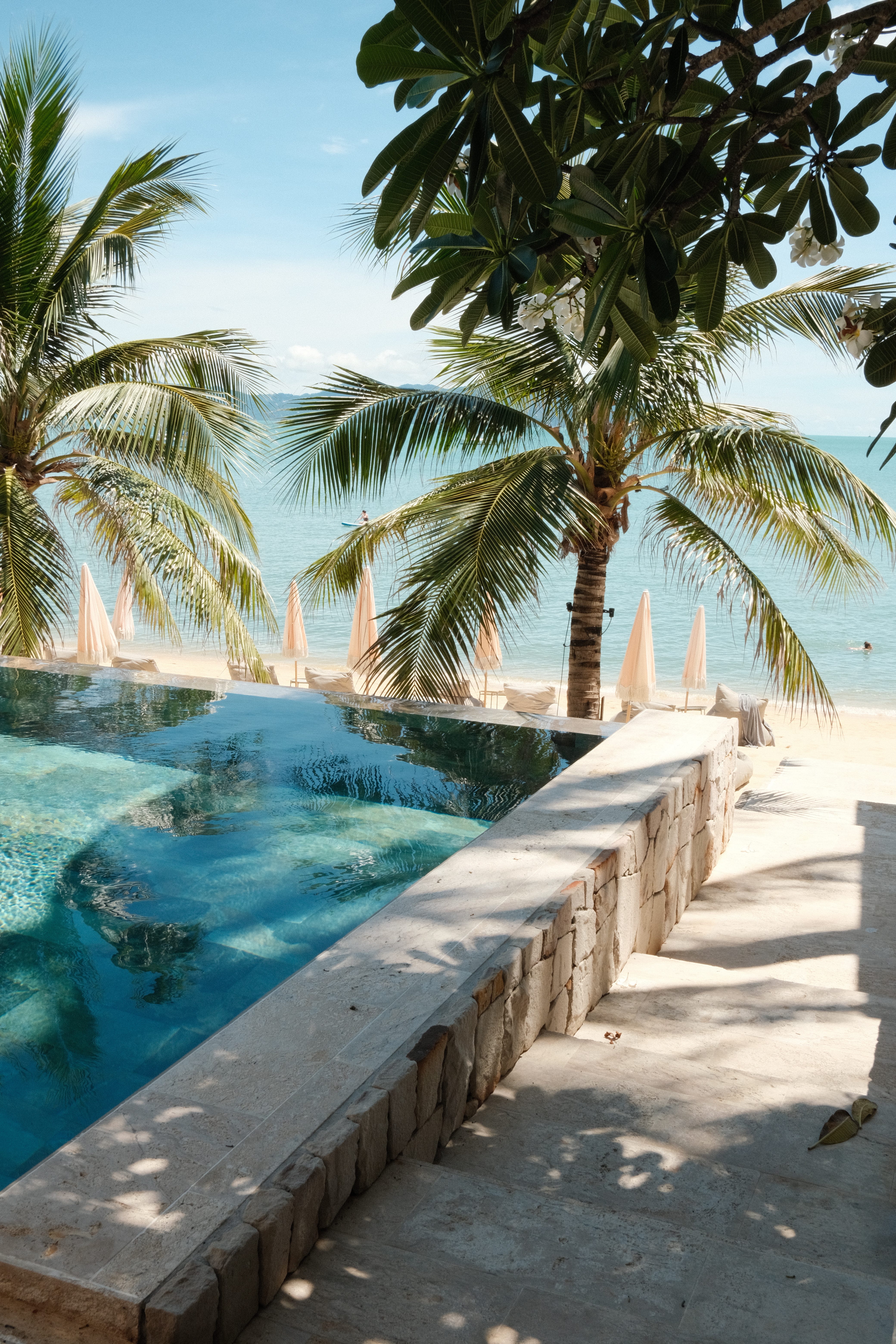 The pool at Cielo Samui, a boutique hotel in Koh Samui, Thailand, leads right to the beach and the sea.