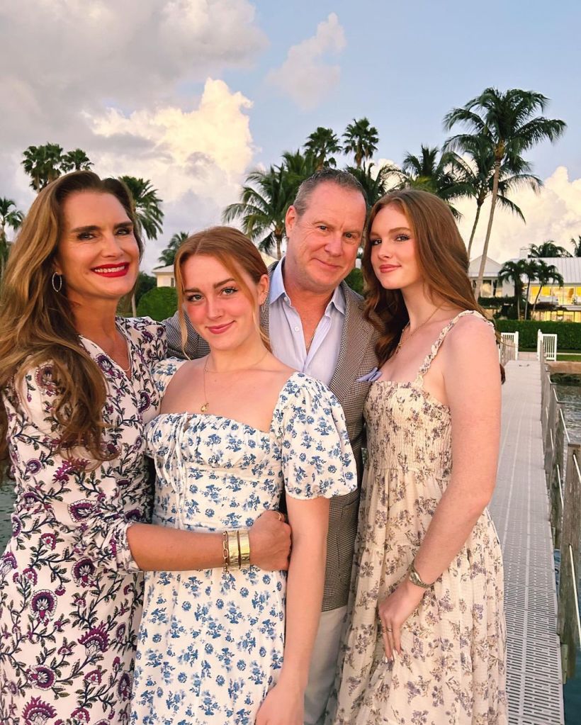 Brooke Shields posing with her husband, Chris, and two daughters.