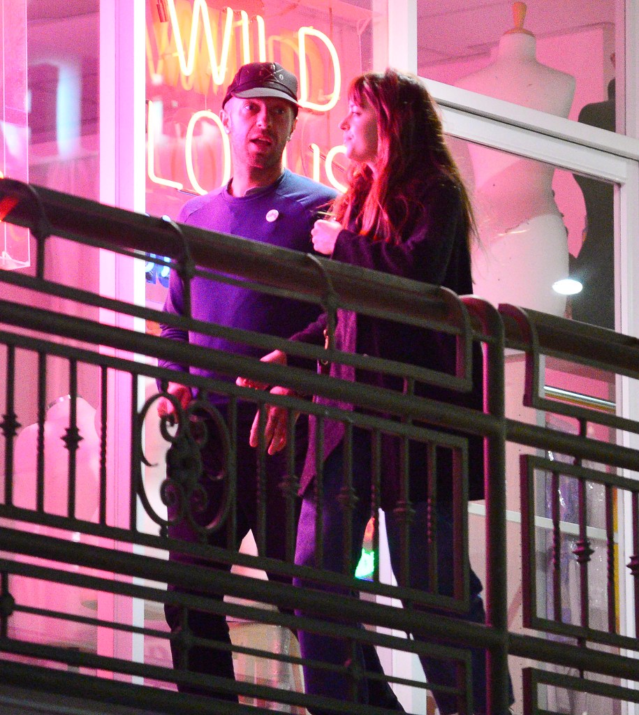 Dakota Johnson & Chris Martin pack on the PDA as they are seen leaving sushi park restaurant 