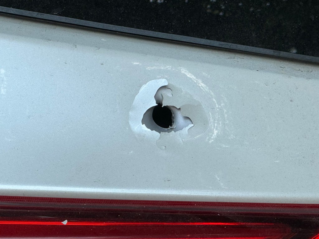 Bullet hole in a car.