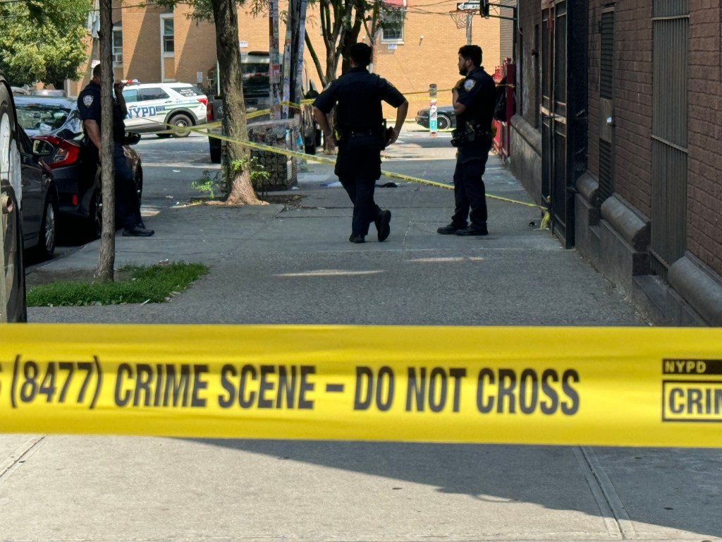 NYPD officers at a crime scene.