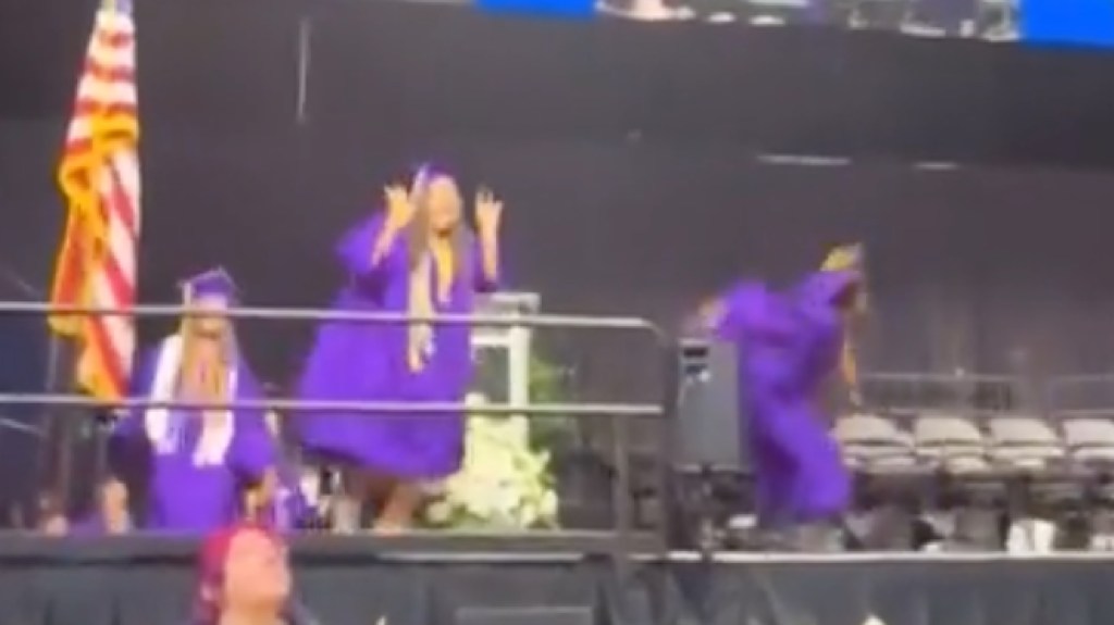 Amelia waves to the crowd as Robinson set to do a backflip inside ick Case Arena.