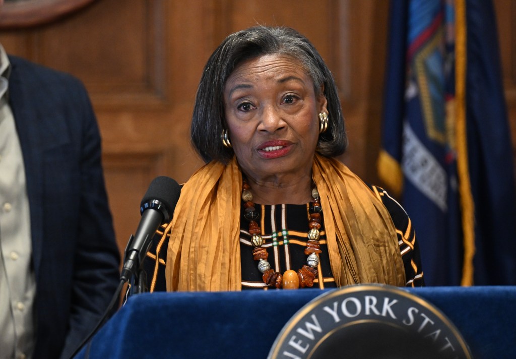 Senate Majority Leader Andrea Stewart-Cousins speaking at a podium.