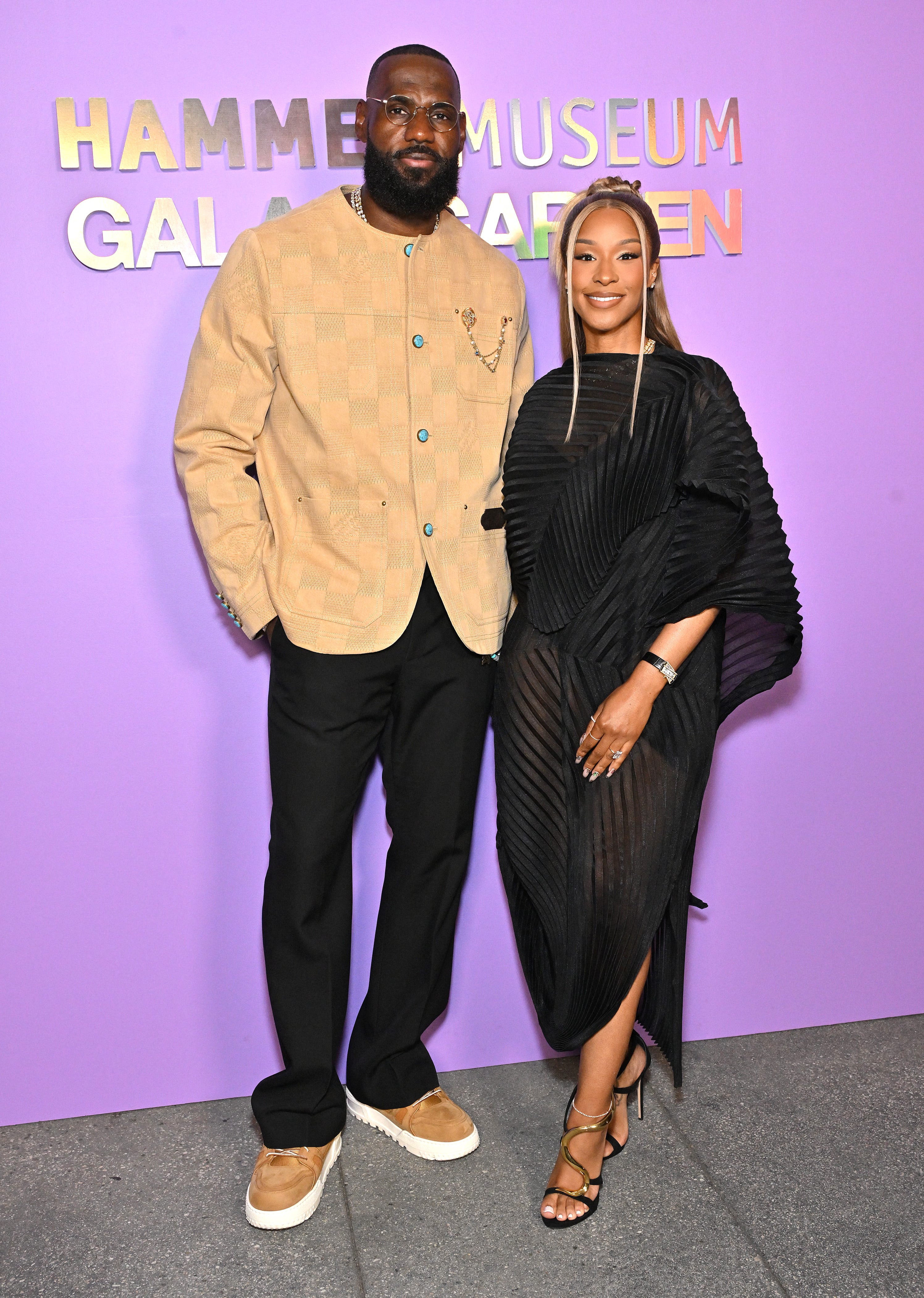 LeBron James and Savannah James pose outside the Hammer Museum Gala.