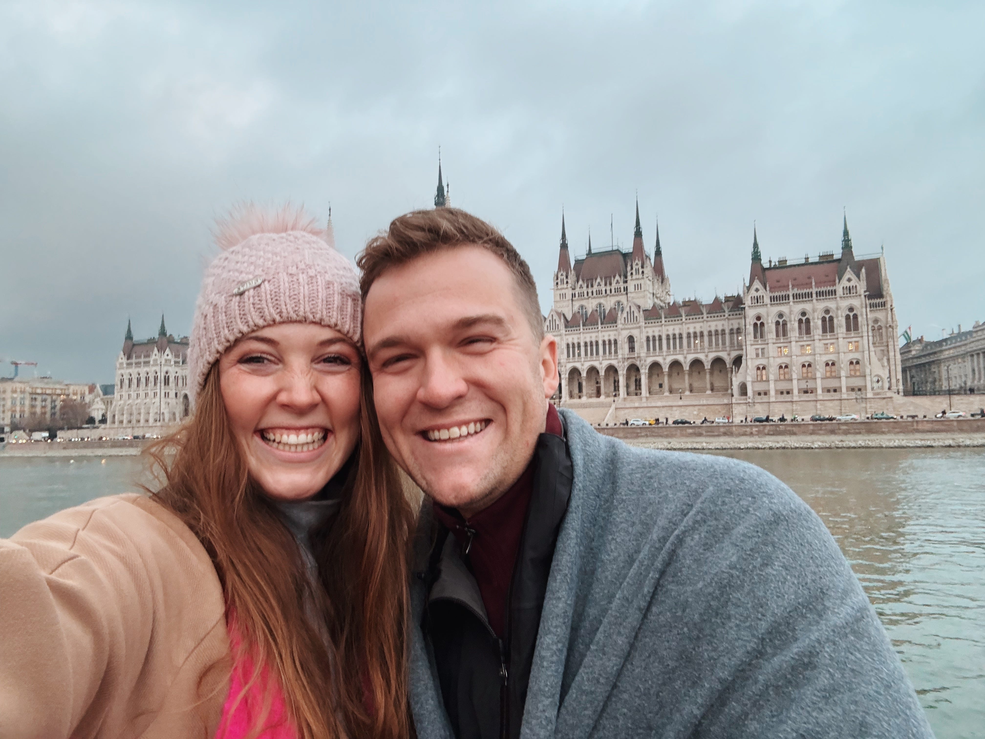 Author Allie Hubers smiling with her husband in Budapest