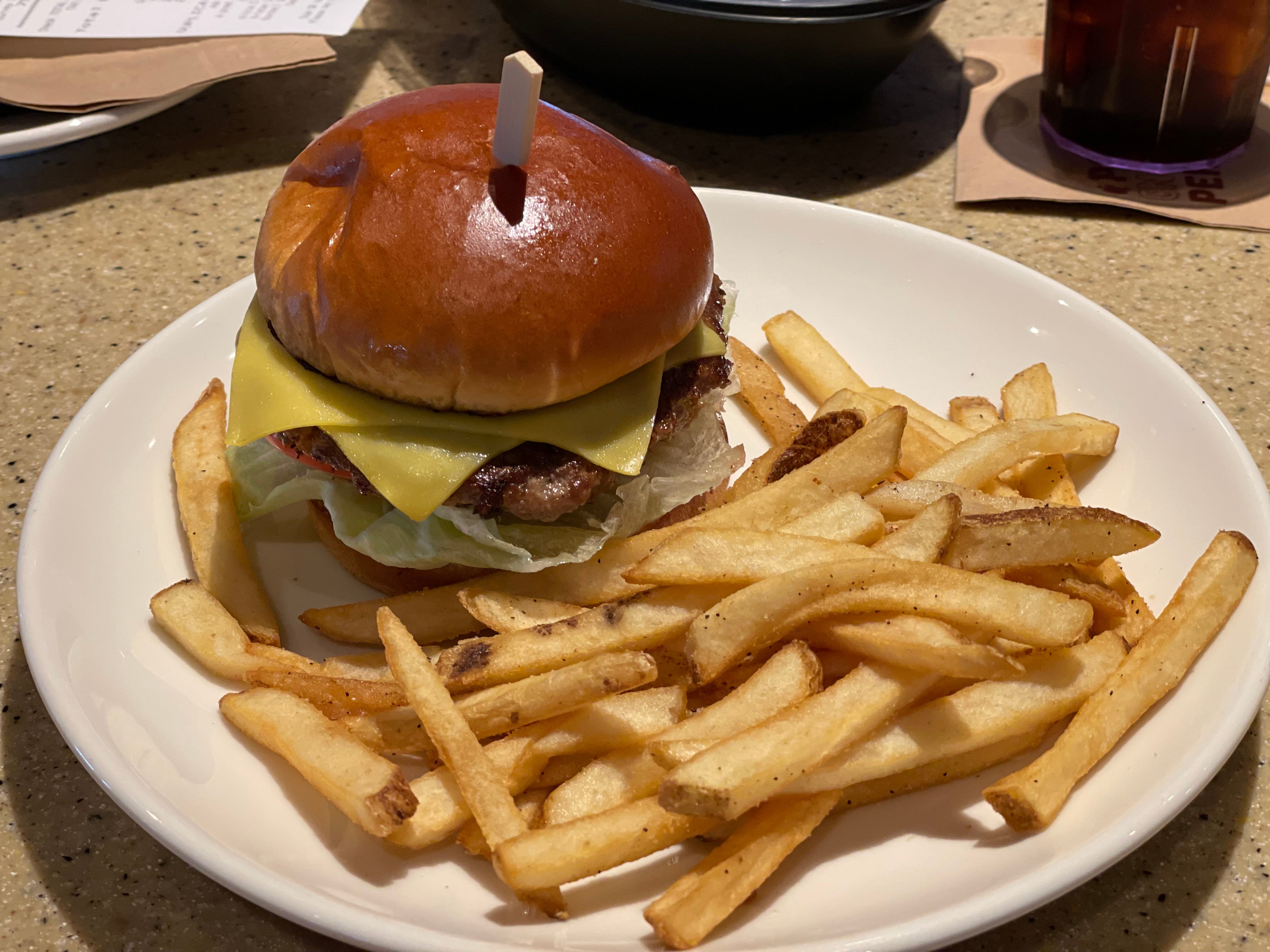 Burger with cheese and fries on the side at Applebee's