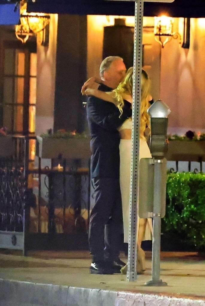 PK Kemsley and Shana Wall kissing.