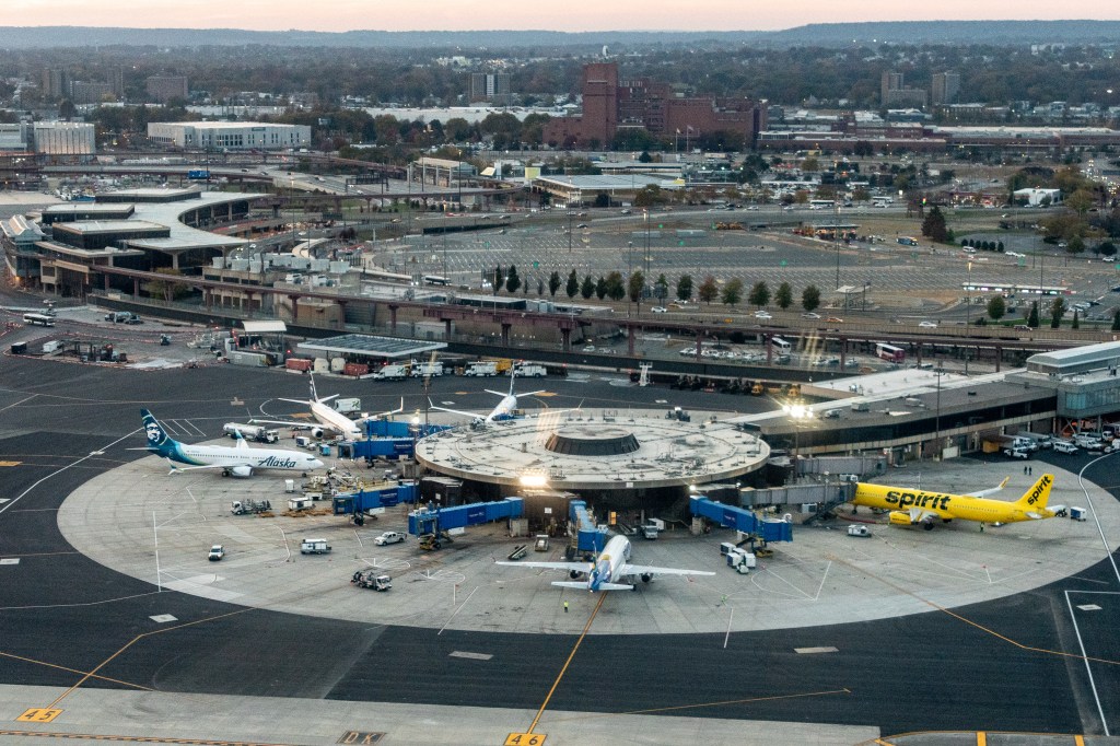 Aerial view of Newark Liberty Airport's old Terminal A, with several airplanes from various airlines.