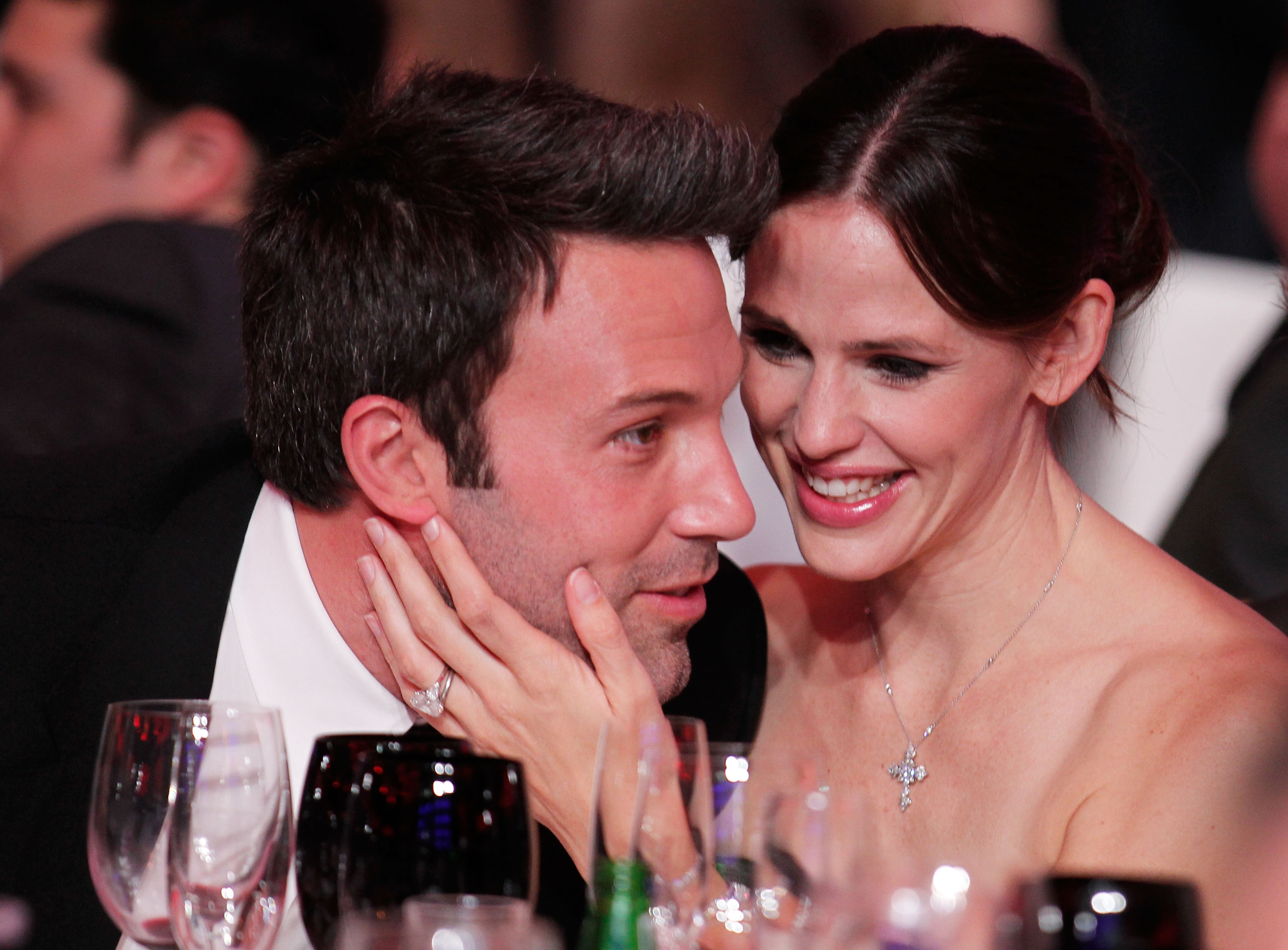 Jennifer Garner touches Ben Affleck's face. 