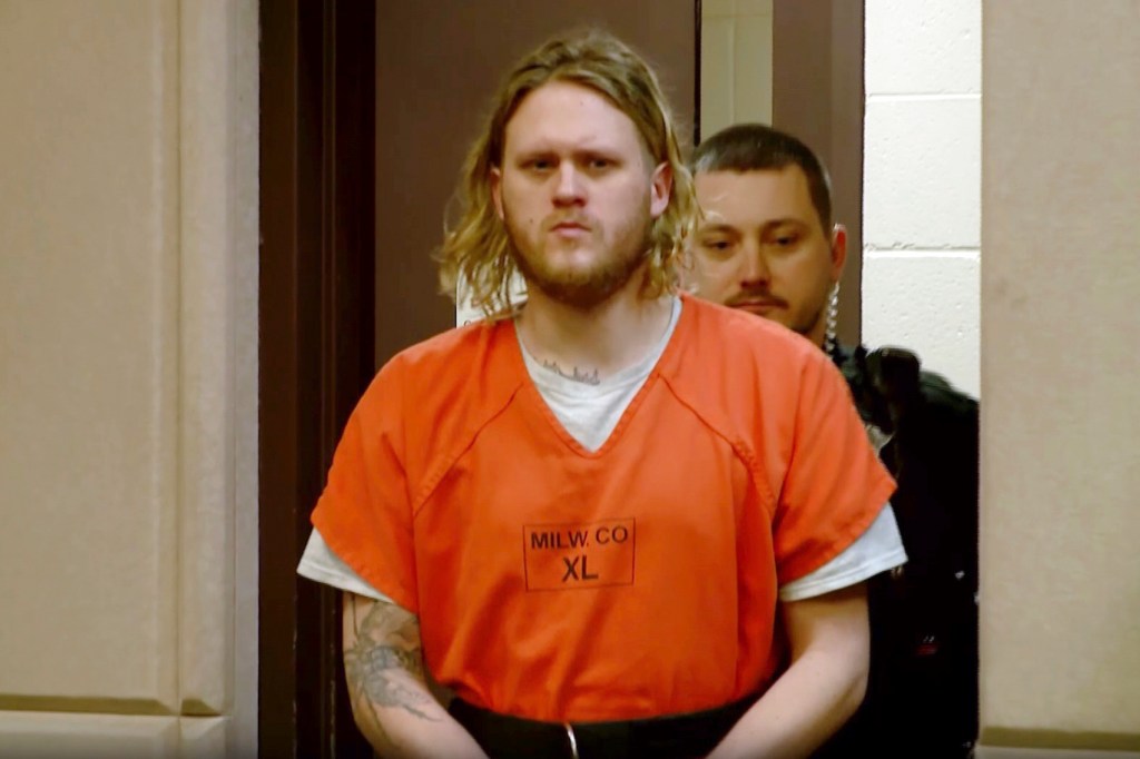 Maxwell Anderson arrives to court wearing an orange prisoner jumpsuit on April 22, 2024.