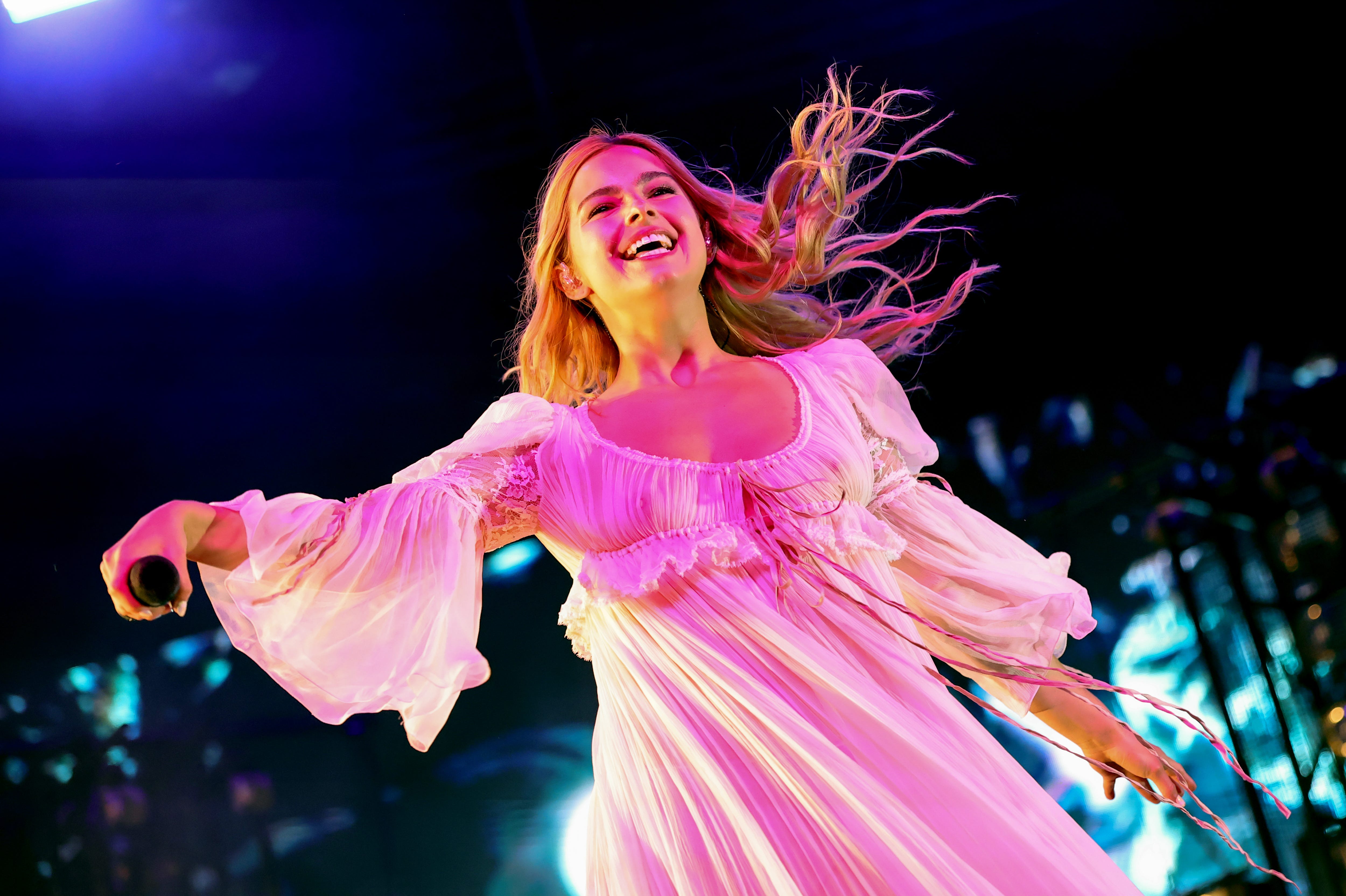 Addison Rae makes a surprise appearance during Arca's set at Coachella in 2025.