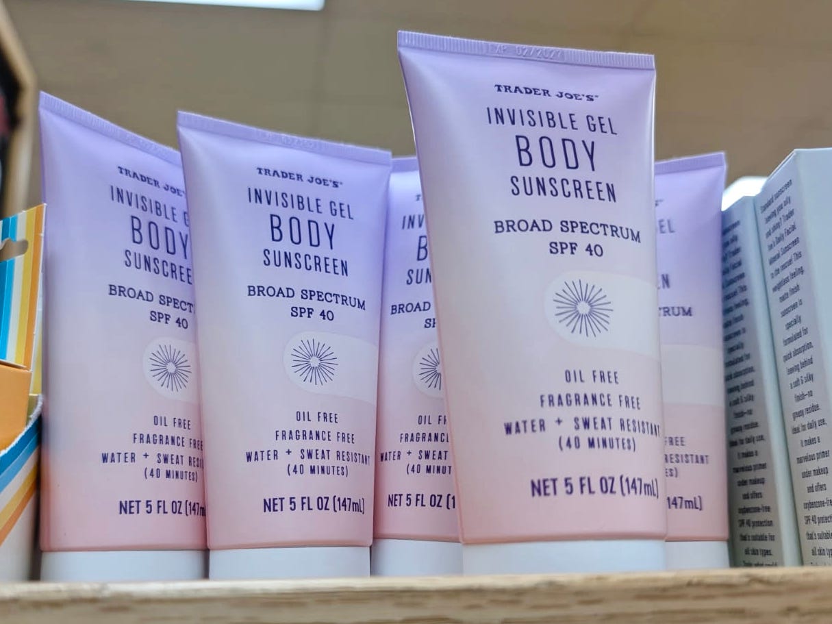 Bottles of invisible gel sunscreen on the shelf at Trader Joe's.
