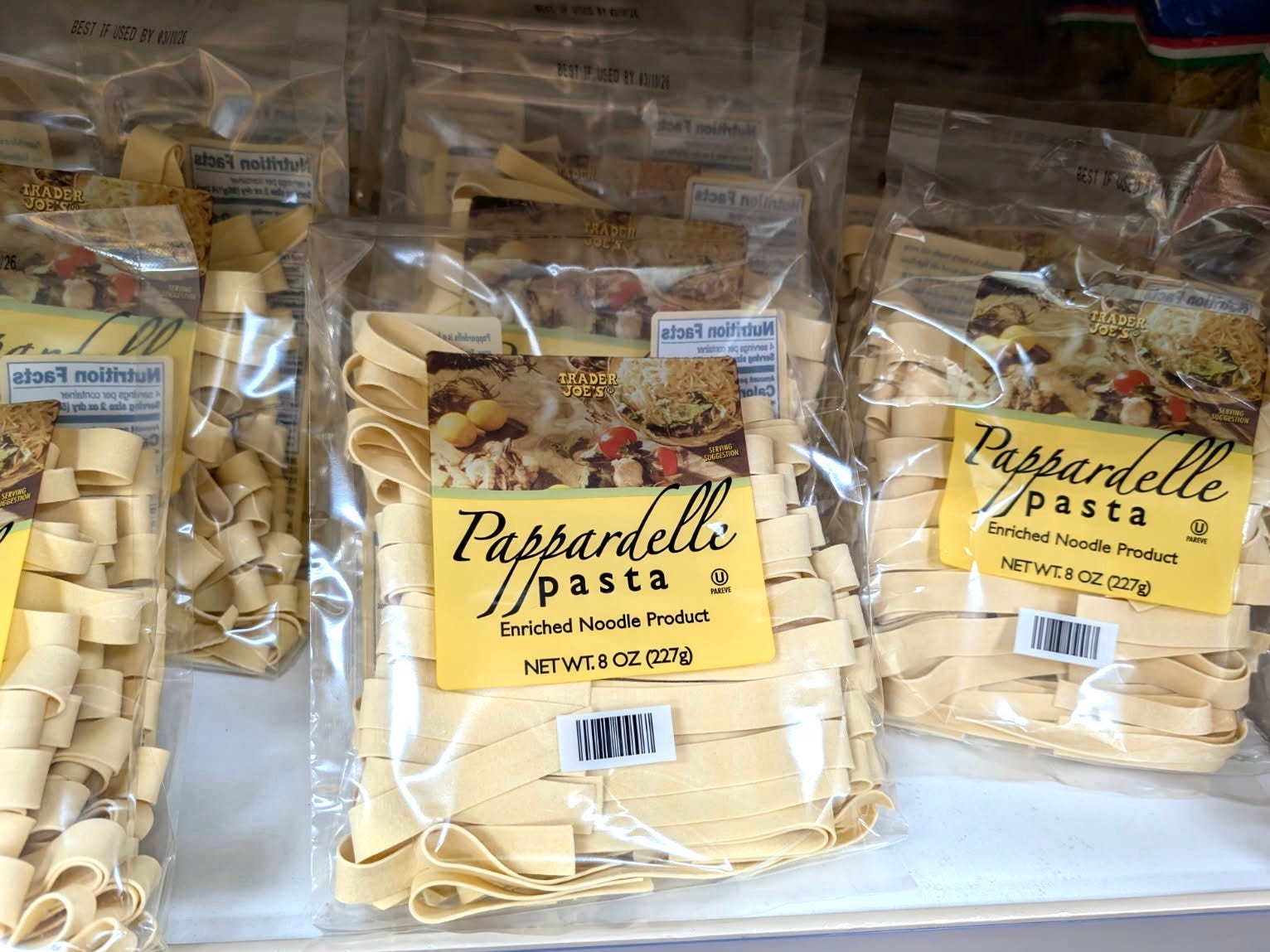 Bags of pappardelle pasta on the shelf at Trader Joe's.