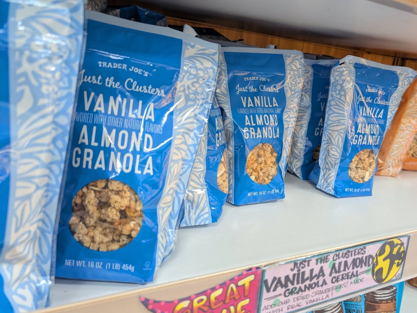 Bags of Just the Clusters vanilla almond granola on the shelf at Trader Joe's.