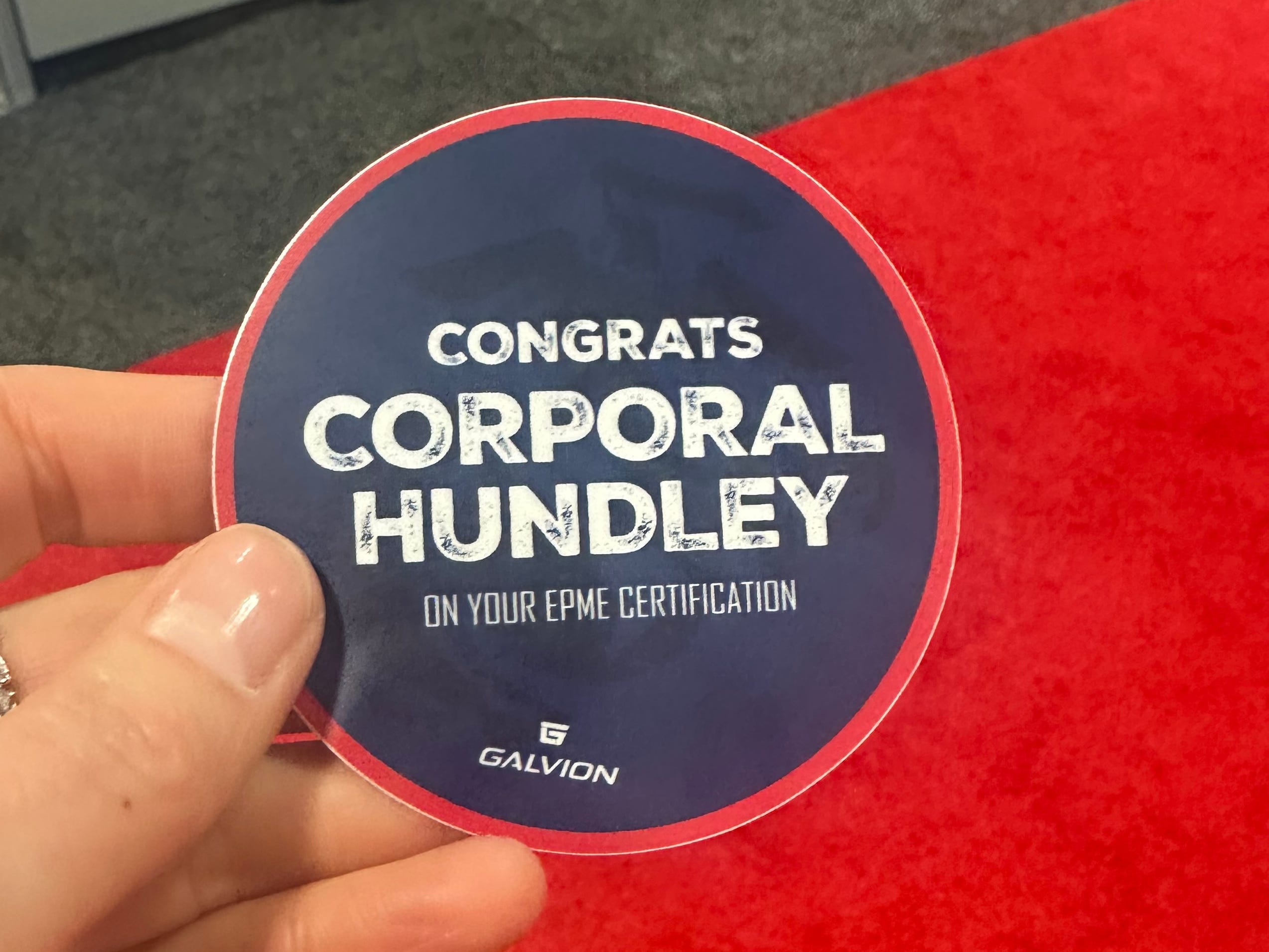 While attending the April 2025 Modern Day Marine Expo in Washington, DC, free swag from defense industry companies included stickers congratulating Corporal Hundley.