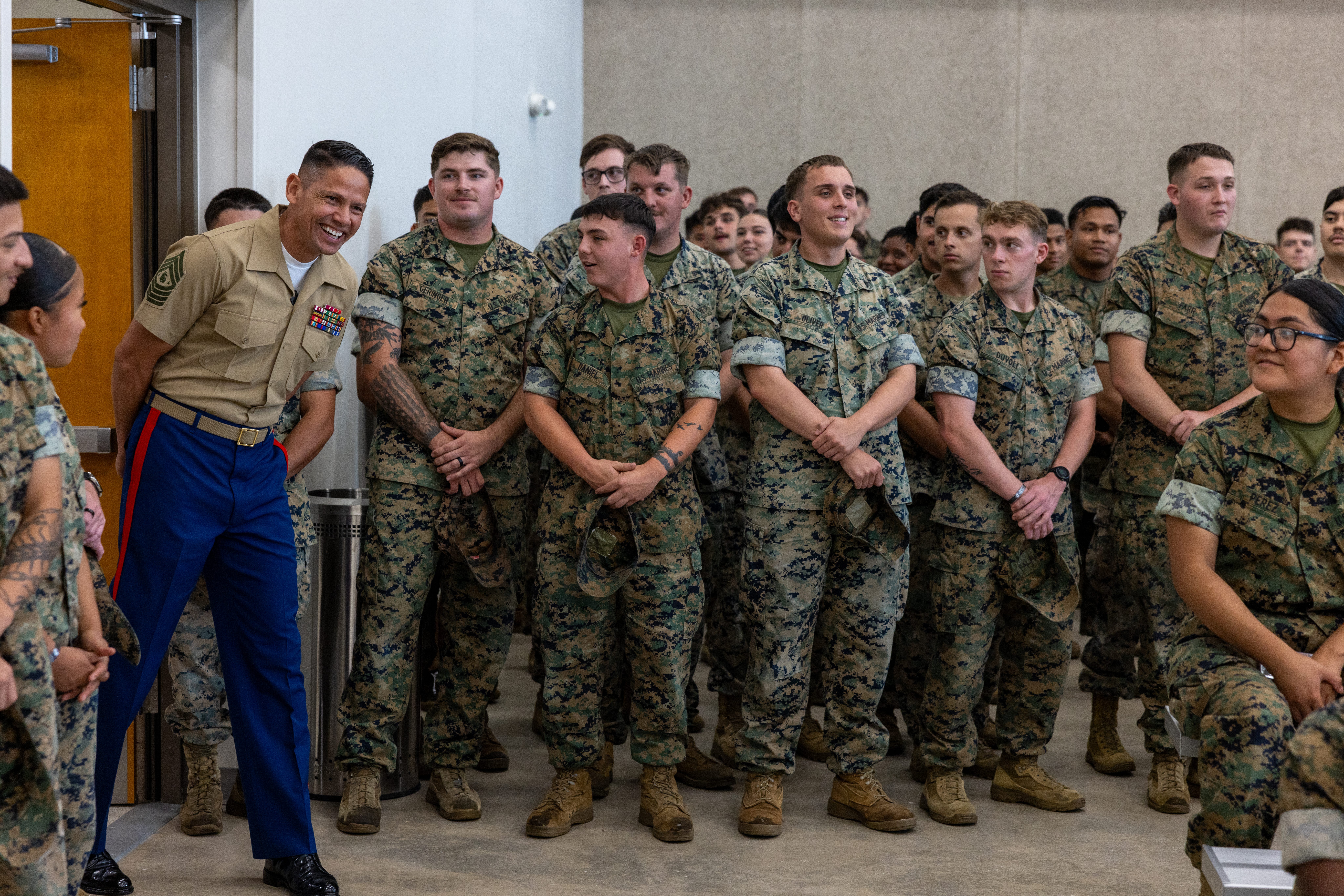 Graduation attendees expressed surprised as the Sgt. Maj. of the Marine Corps Carlos Ruiz enters the room at Camp Johnson, NC, June 5, 2025.