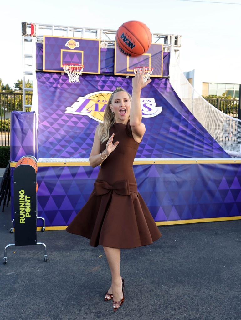 Kate Hudson attempts to hit one off the backboard at an LA screening of her Netflix show “The Running Point.” 