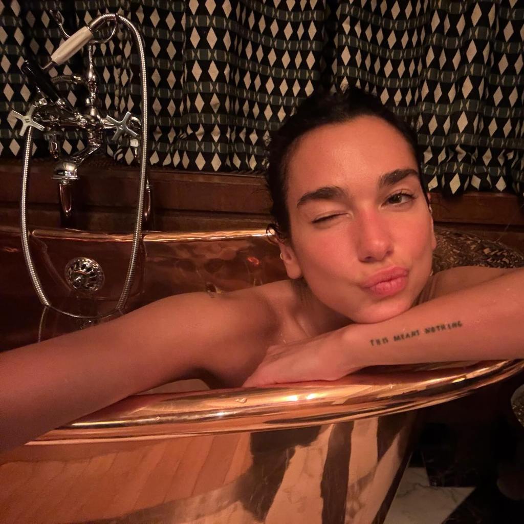 In Amsterdam, Dua Lipa winds down in between performances.