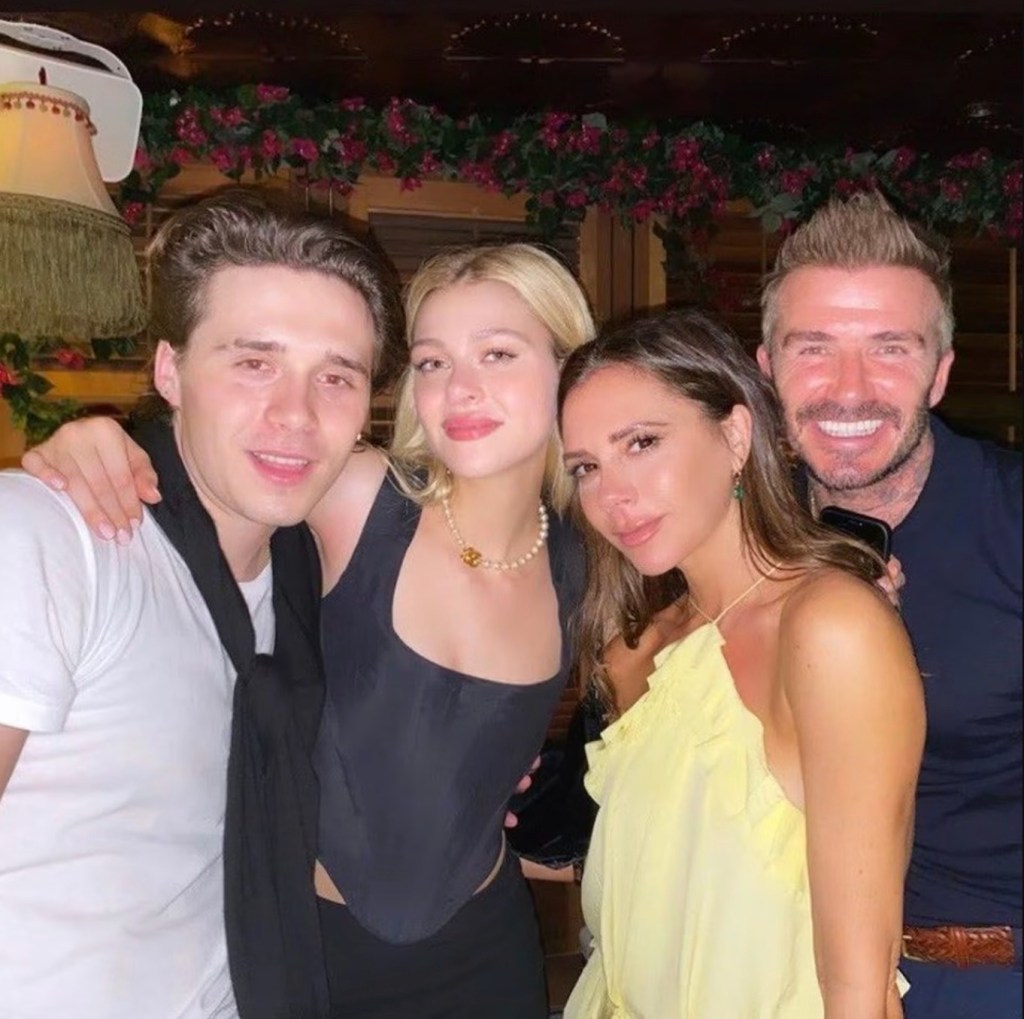 David Beckham in a dark shirt, Victoria Beckham in a yellow dress, Nicola Peltz Beckham in a black corset and black pants, Brooklyn  Beckham in a white t-shirt.