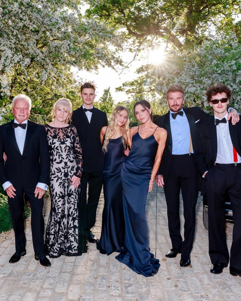 Tony Adams in a black tuxedo, Jackie Adams in a black pattered gown, Romeo Beckham in a black tuxedo, Victoria Beckham and Harper Beckham in matching blue gowns, David Beckham in a tuxedo and Cruz Beckham in a tuxedo.