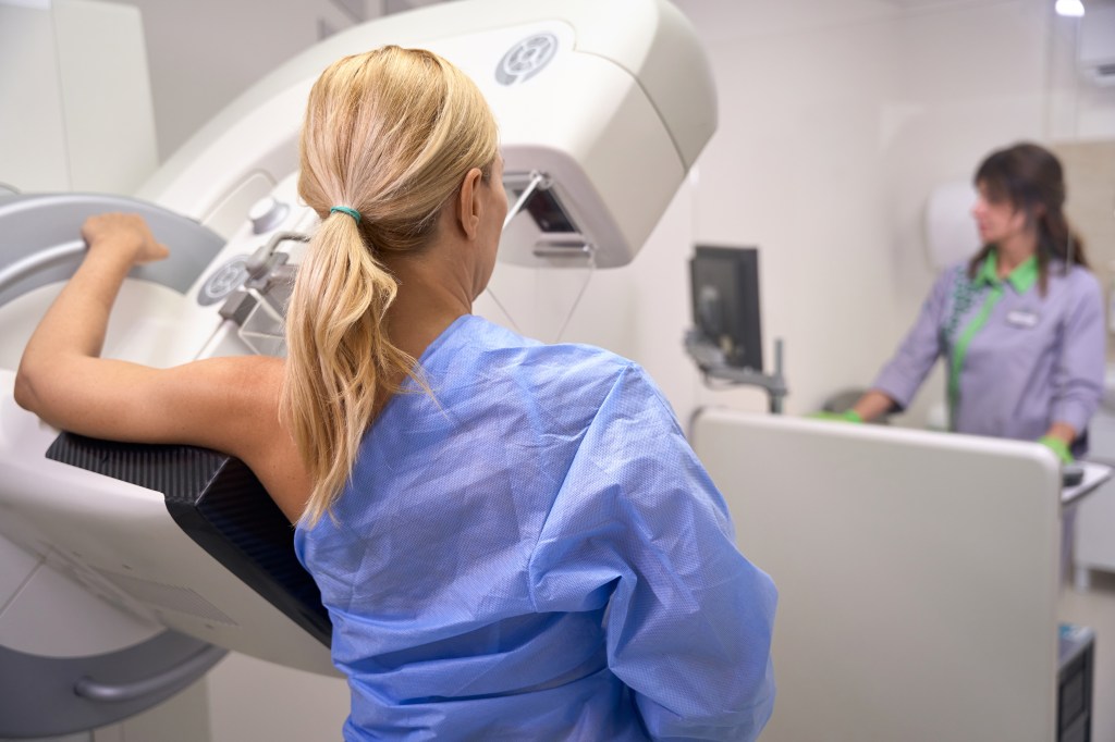 Woman undergoing a 3D mammogram.