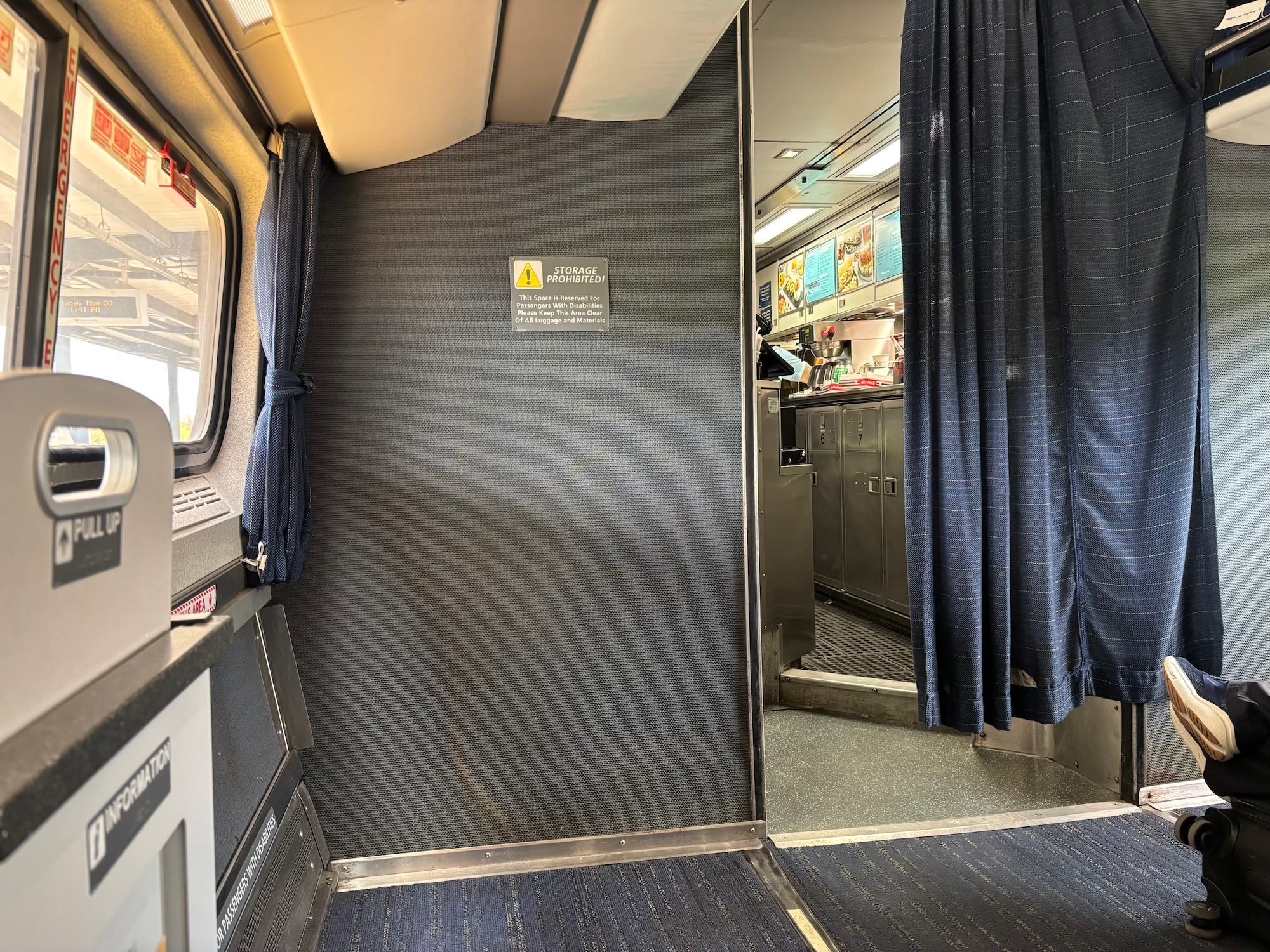 A photo of a curtain leading to a café cart on an Amtrak train.