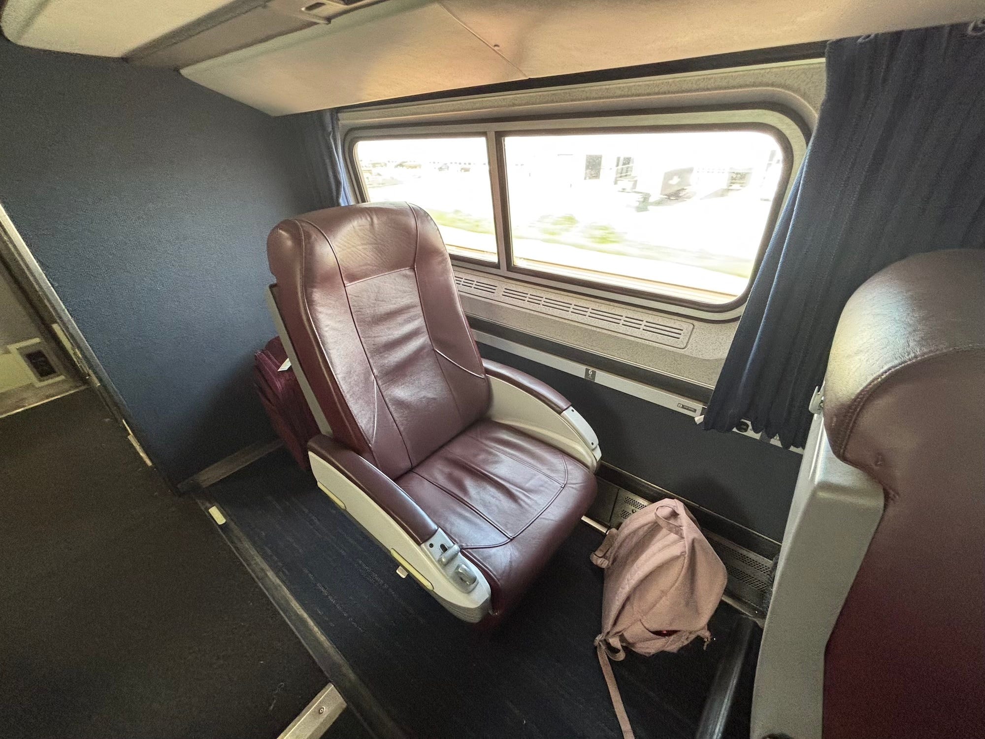 A maroon seat on an Amtrak train.