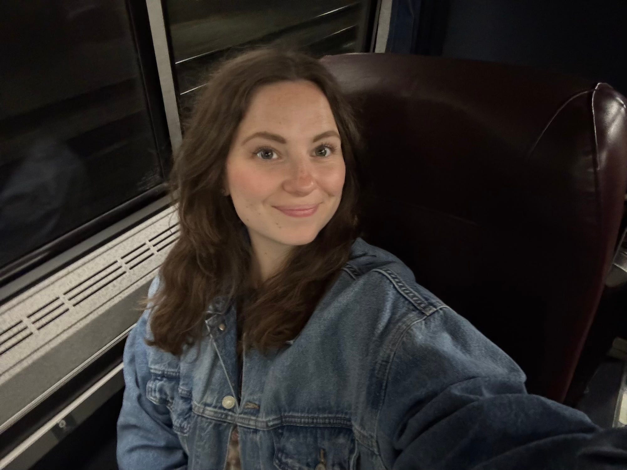 A selfie of a woman on an Amtrak train.