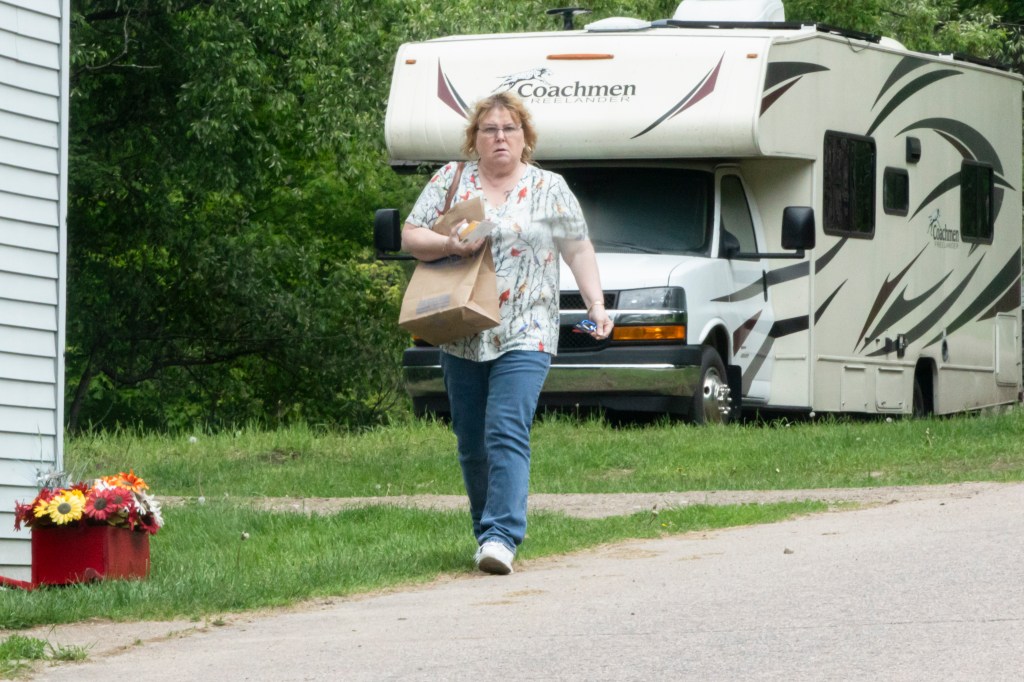 Joyce Mitchell walking outside of her Dickinson home on May 30, 3025
