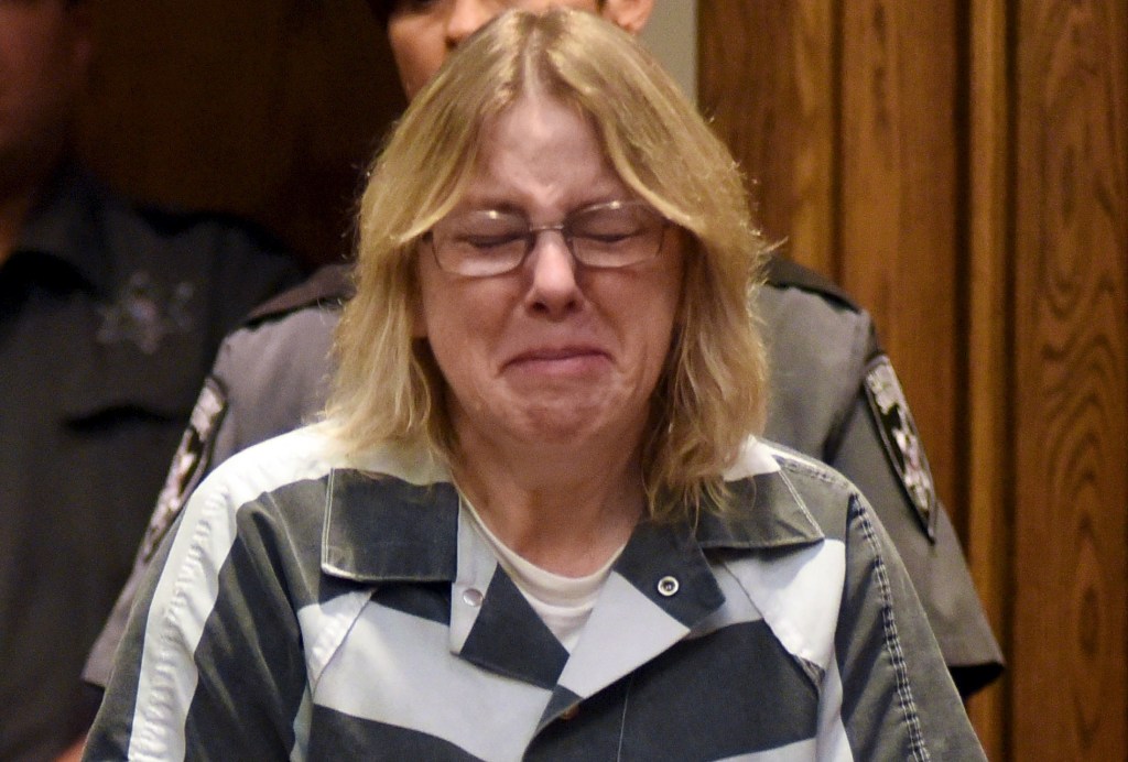Joyce Mitchell crying during her sentencing while wearing a prison uniform in Clinton County Court on Sept. 28, 2015