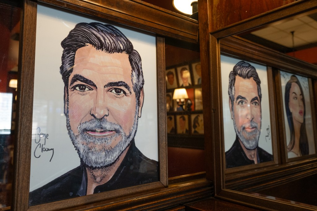 Framed caricature of George Clooney with his autograph at Sardis