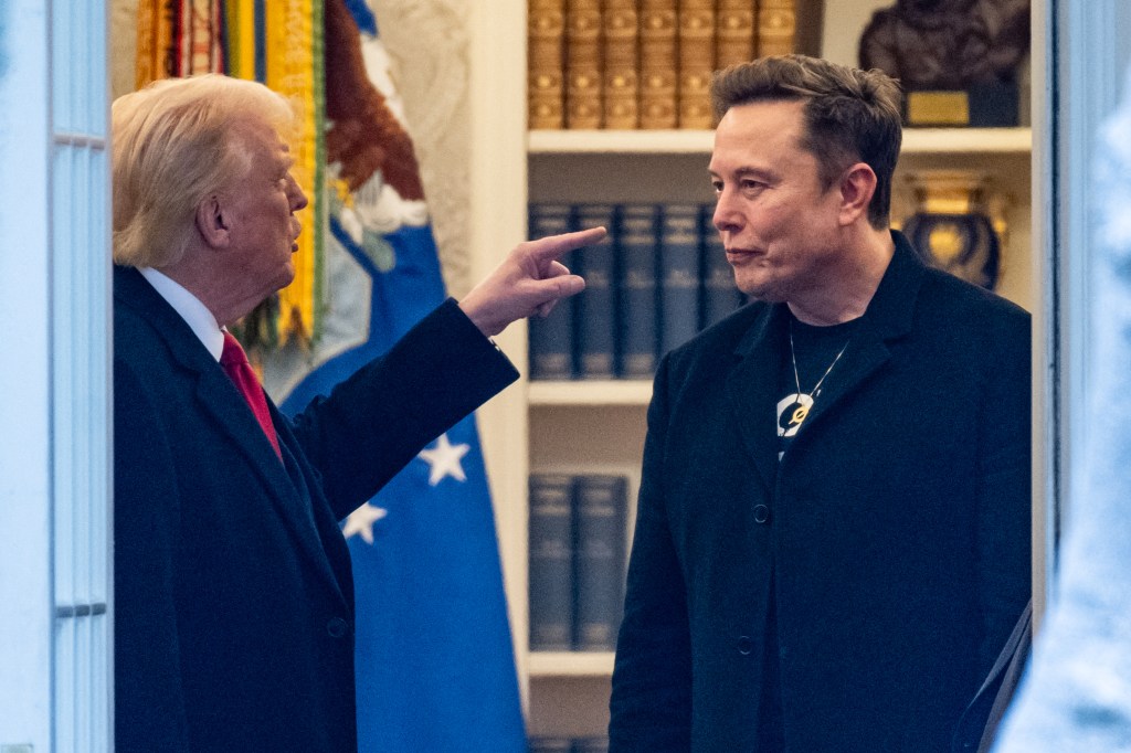 Donald Trump pointing at Elon Musk in the Oval Office.