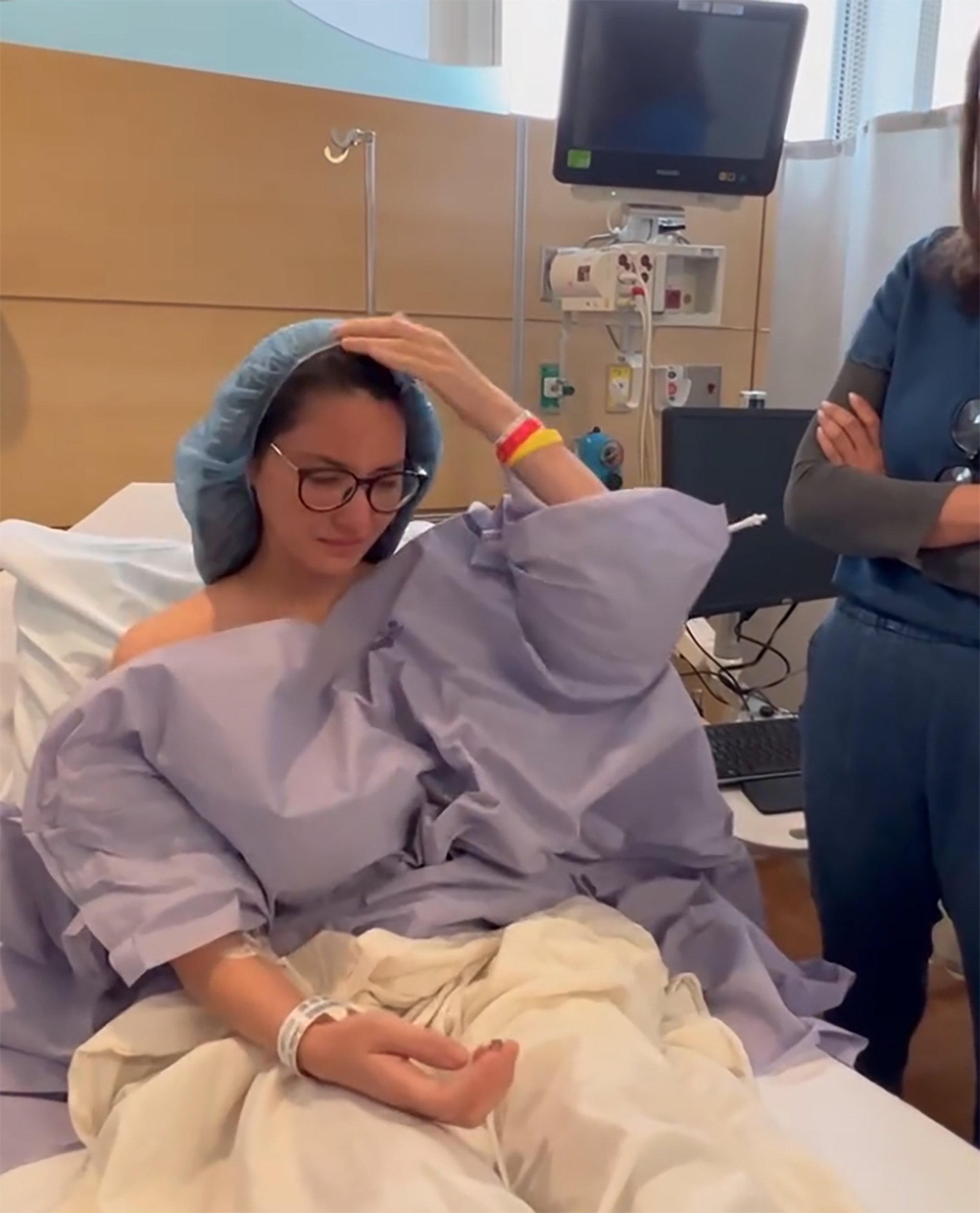 Olivia Munn in a hospital bed.