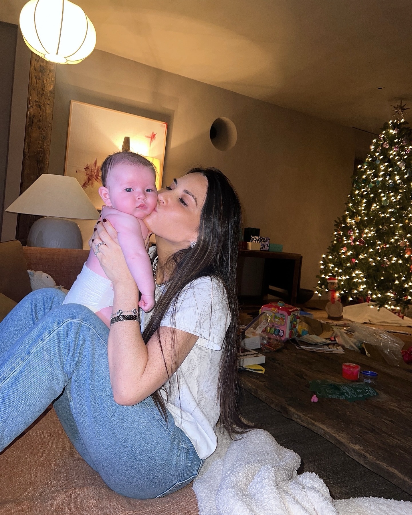 Olivia Munn holding her daughter.