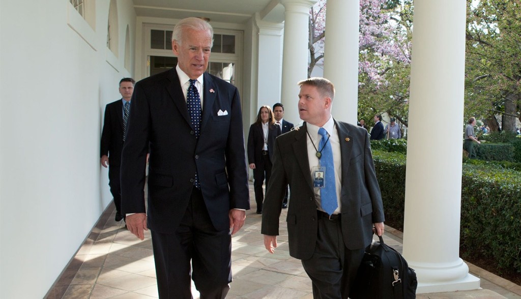 Joe Biden and Kevin O’Connor walking and talking.